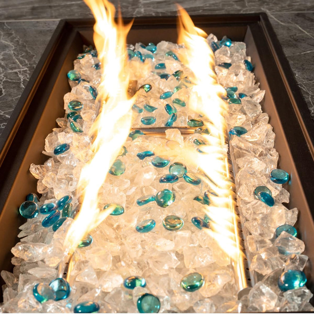 44in Outdoor Propane Gas Fire Pit Table, 50,000 BTU Auto-Ignition Gas Firepit with Glass Wind Guard, Marble Tile Tabletop, Mixed Color Glass Rocks, Brown PE Rattan