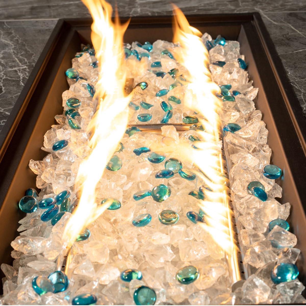44in Outdoor Propane Gas Fire Pit Table, 50,000 BTU Auto-Ignition Gas Firepit with Glass Wind Guard, Marble Tile Tabletop, Mixed Color Glass Rocks, Brown PE Rattan