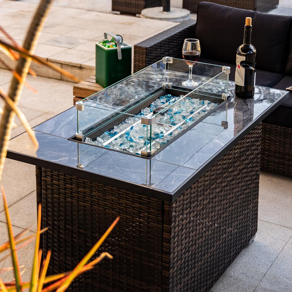 44in Outdoor Propane Gas Fire Pit Table, 50,000 BTU Auto-Ignition Gas Firepit with Glass Wind Guard, Marble Tile Tabletop, Mixed Color Glass Rocks, Brown PE Rattan